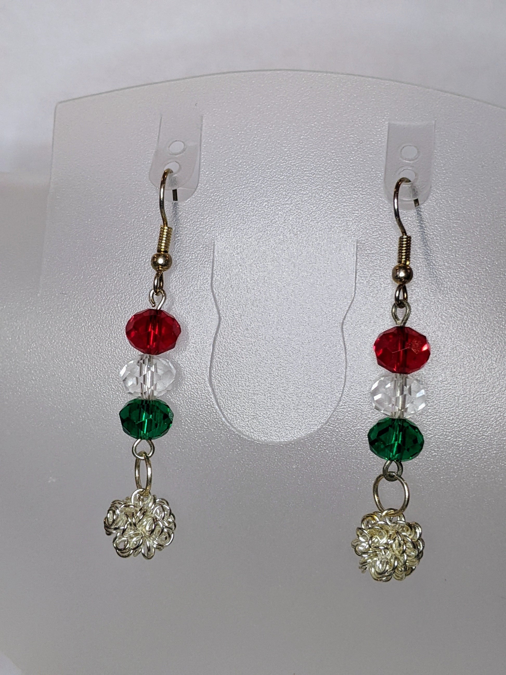 Festive dangle earrings with silver chain and red, crystal, and green faceted glass beads with french hook ear wires