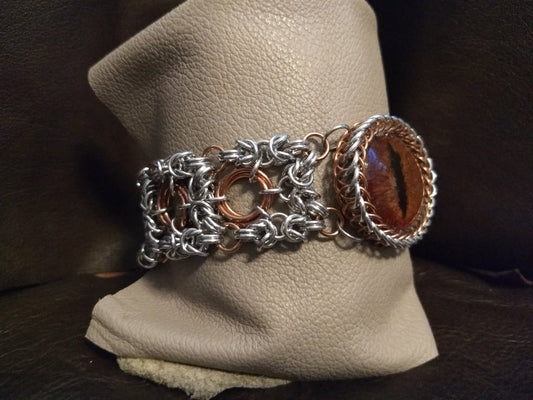 Striking Dragon Eye on a byzantine/moebius chainmail bracelet Chainmail Bracelets Dragon & Wolf Designs