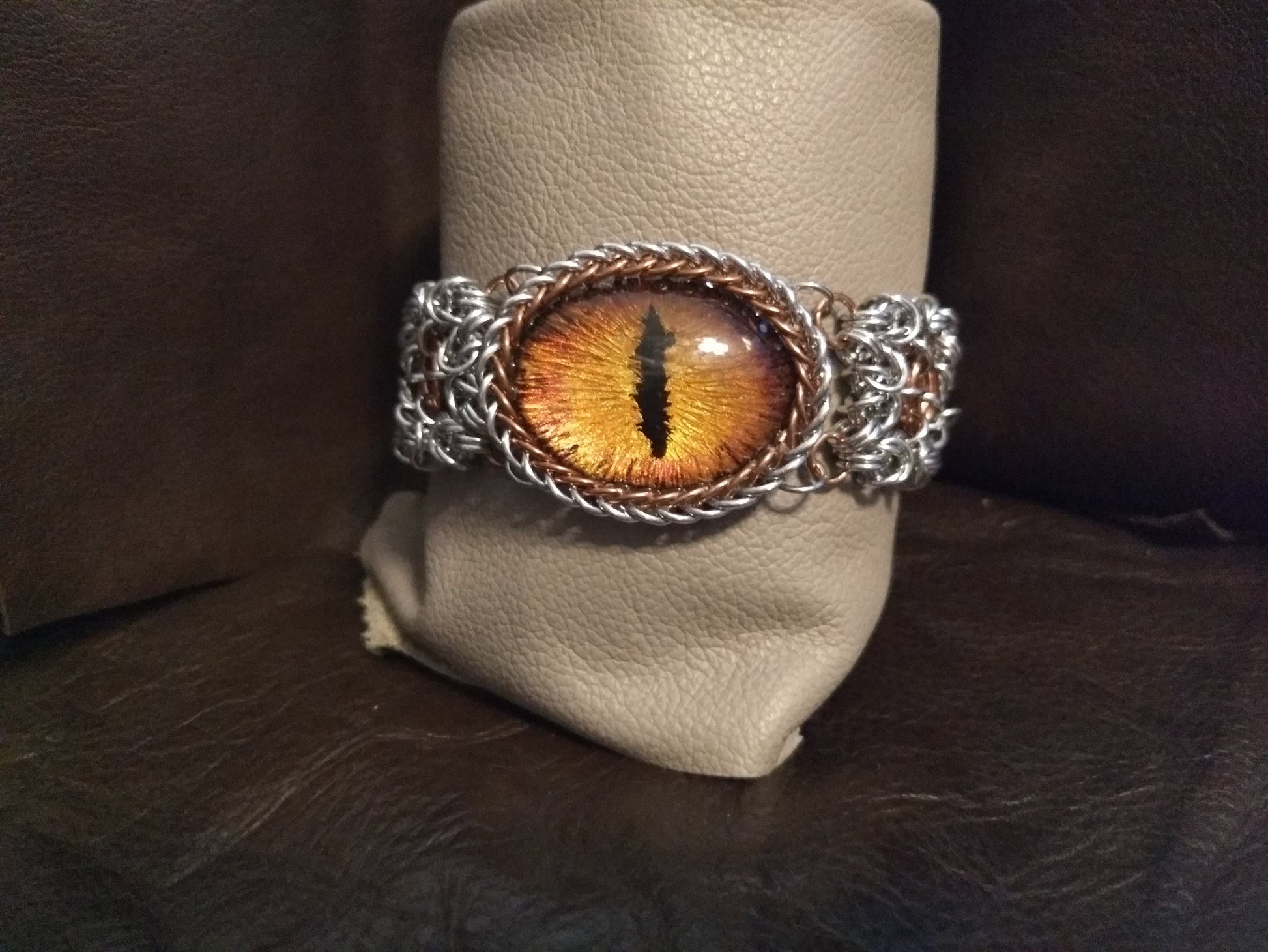 Striking Dragon Eye on a byzantine/moebius chainmail bracelet Chainmail Bracelets Dragon & Wolf Designs