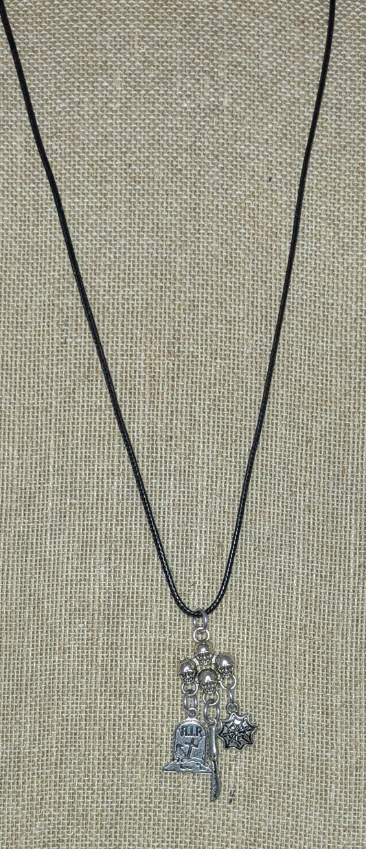 Necklace with charms on a textured surface